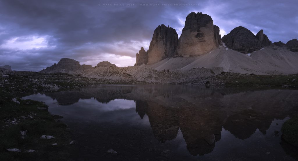 The North Faces of Tre Cime, with Mt Piana to the right, reflected in an alpine pool at Twilight