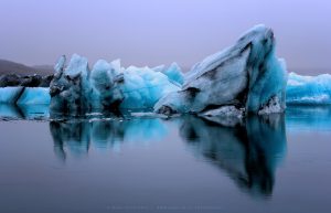 Intense Icebergs floating in Jokulsarlon, the Glacier Lagoon in Southern Iceland