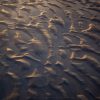 Early morning link cast across sand textures in Sussex