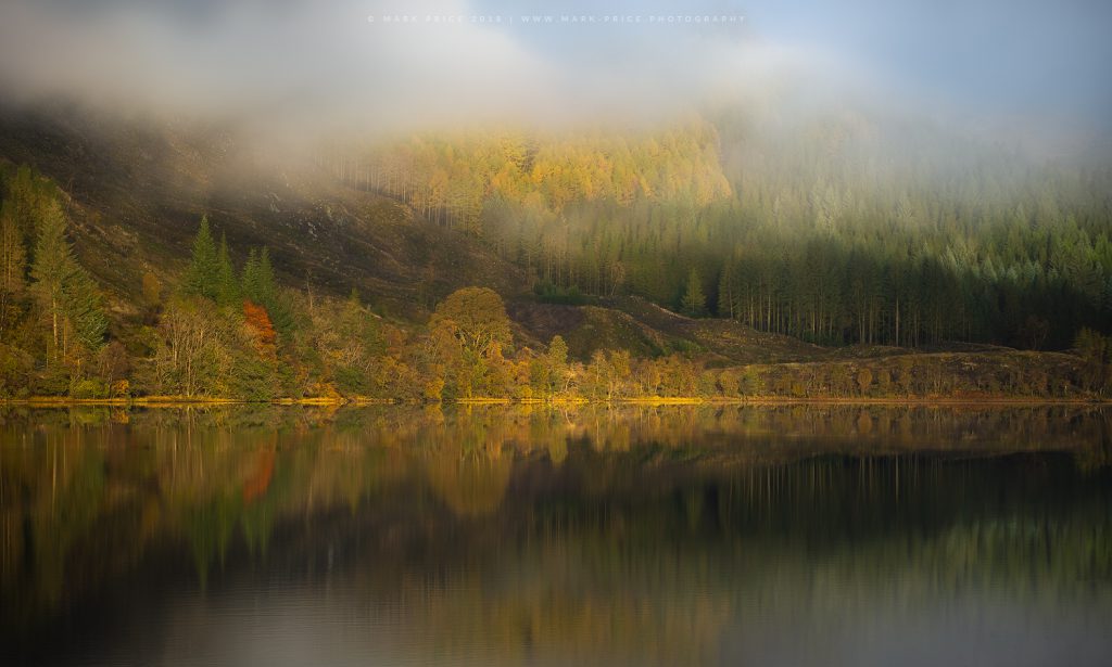 The banks of a Scottish loch during peak Autumn