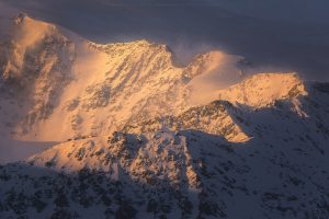Early morning light casting across a wintery ridge