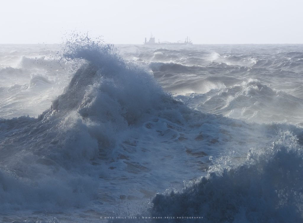 Storm Waves crash in the water off the Sussex coast in winter