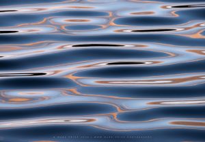 Psychedelic patterns of light reflecting from the water in a Sussex river