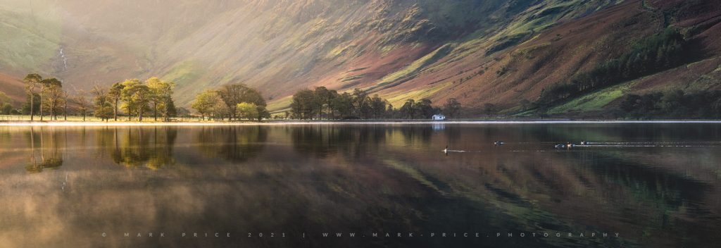 The stunning Sentinels on Buttermere Lake as first light takes hold