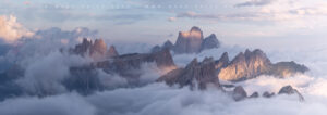 The giant mountains of Northern Italy emerging from a cloud inversion