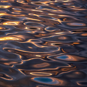 Wild water patterns during a colourful autumn sunset