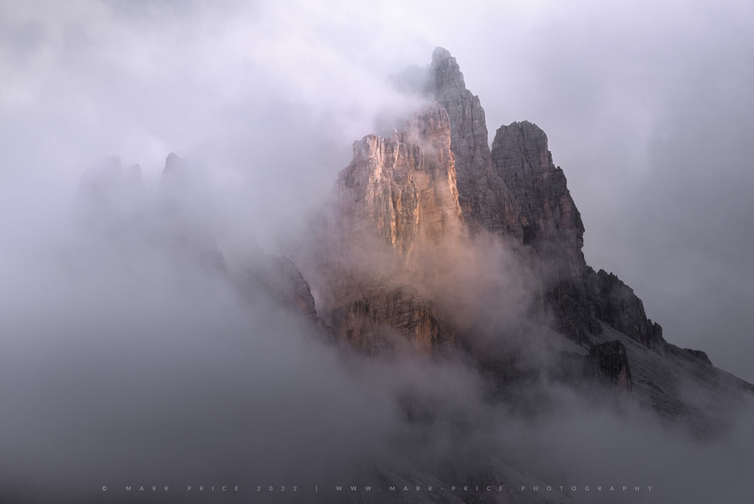 Light and cloud combined with endlessly vertical rock create a moment in Italy