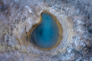 An aerial view of a geothermal pool in the centre of Iceland