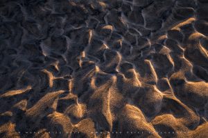 Beautiful last light making coastal sand patterns look 3d - Winter 2024