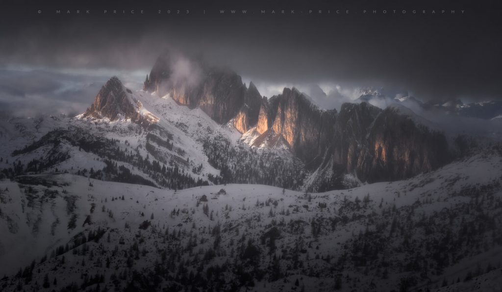 Last light striking the imposing peaks of the Dolomites in the peak of winter..
