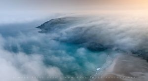 Rolling sea fog across a Cornish bay, June 2026